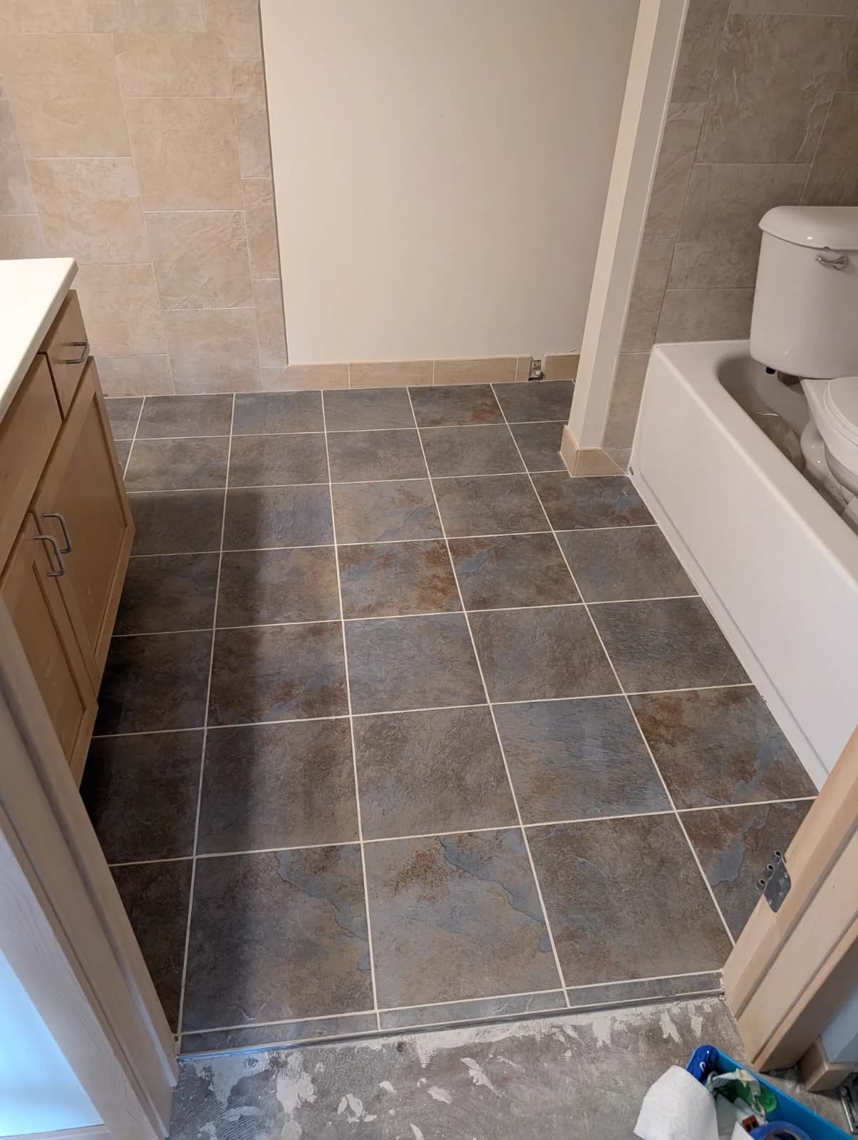 Porcelain tile set and grouted · bathroom