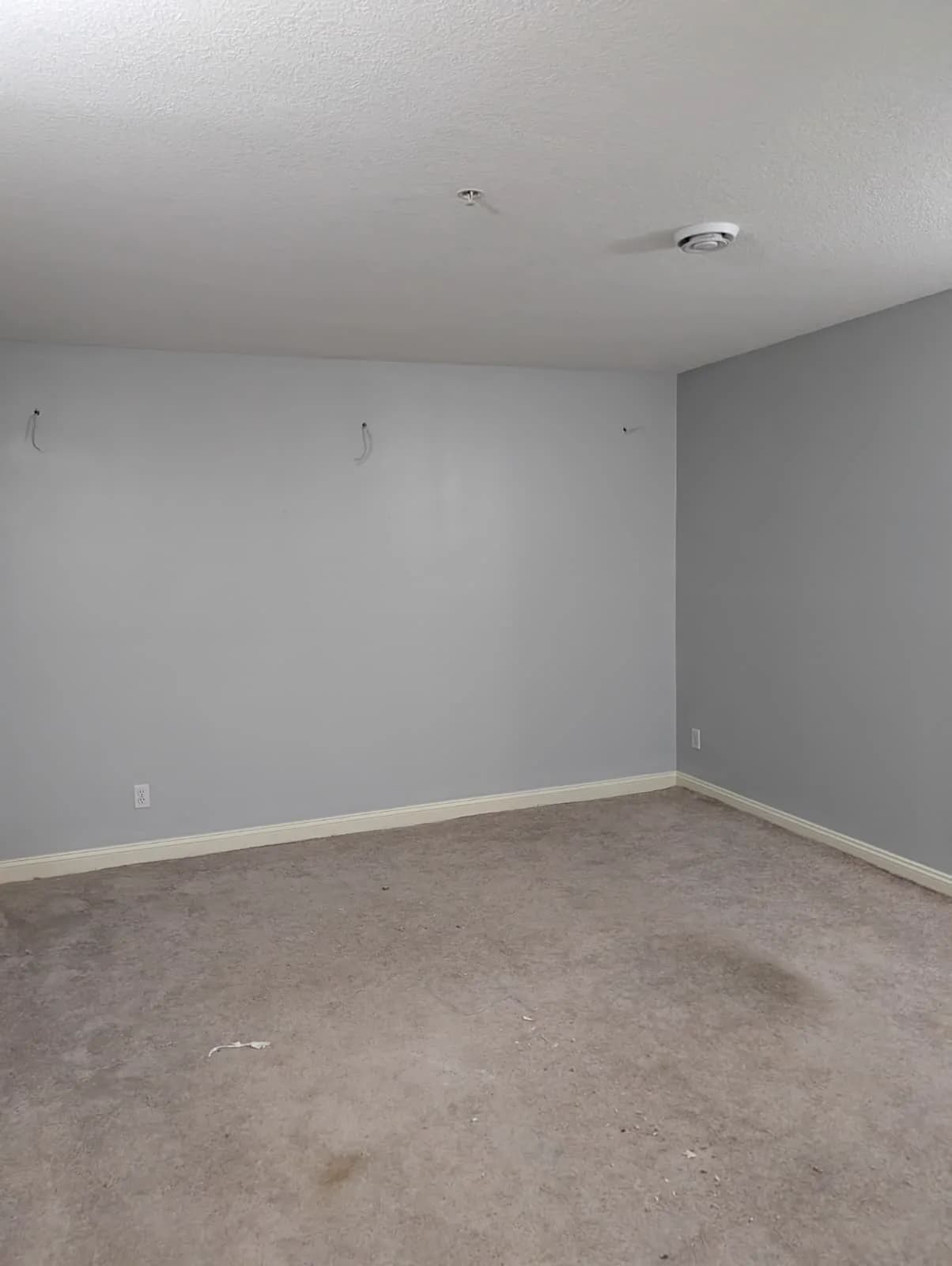 Same room, ceiling closed and painted
