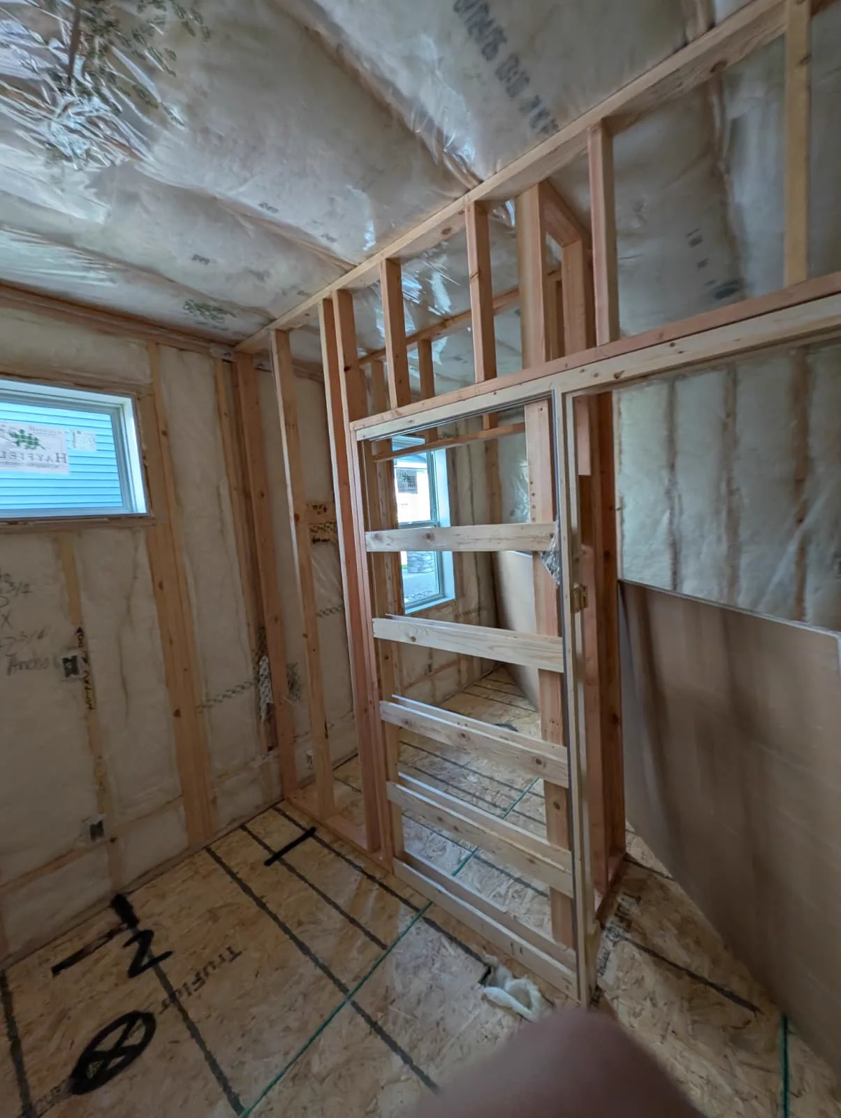New doorway framed in the addition